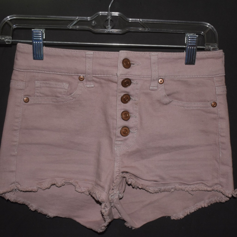 Light pink denim shorts.